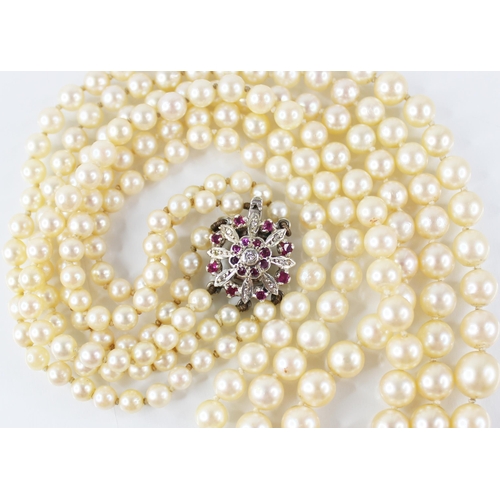 138 - A cultured pearl necklace, comprising three rows of graduated round cultured pearls measuring betwee... 