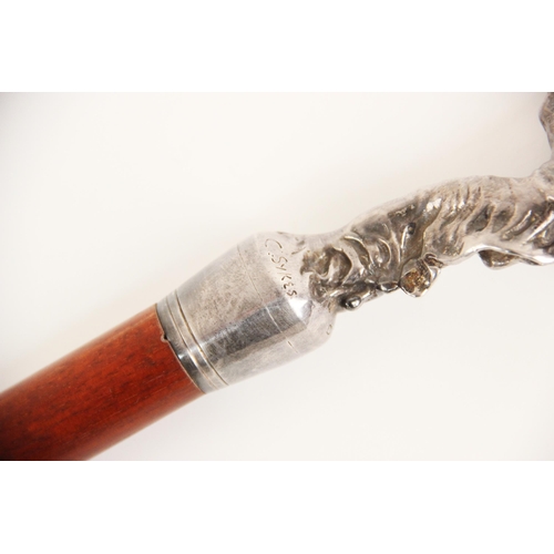 155 - A stained beech wood cane, early 20th century, mounted with a cast metal Rolls Royce 