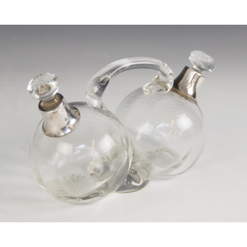 27 - A George V silver mounted cut glass oil and vinegar cruet, James Deakin & Sons, Sheffield 1927, desi... 