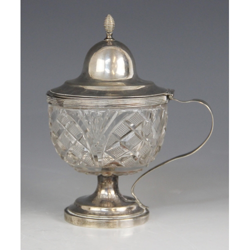 28 - A Dutch cut glass silver mounted wet mustard, the circular body with hobnail detail, raised on circu... 