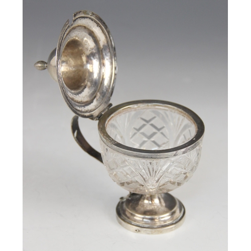 28 - A Dutch cut glass silver mounted wet mustard, the circular body with hobnail detail, raised on circu... 