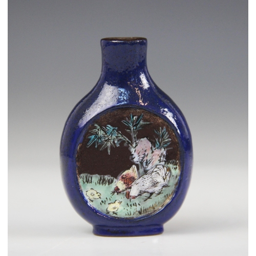 305 - A Chinese blue-ground Yixing stoneware snuff bottle, 19th century, decorated with two reserves depic... 