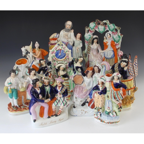 371 - A selection of 19th century Staffordshire flat back figural groups, to include St George, 29.5cm hig... 