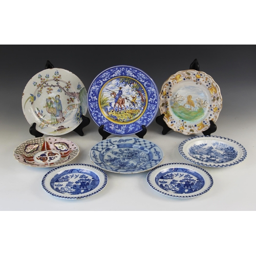 377 - An 18th century Delft tin-glazed earthenware plate, in the Fazackerley colour palette, decorated wit... 