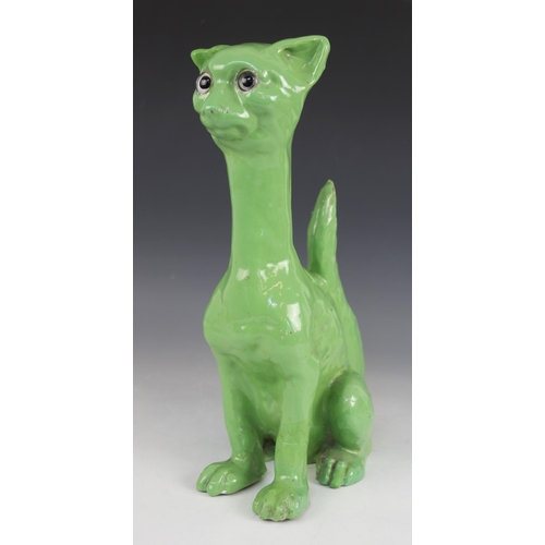 388 - A stoneware model of a cat, 20th century, in the manner of Galle, glazed in green with colourless gl... 