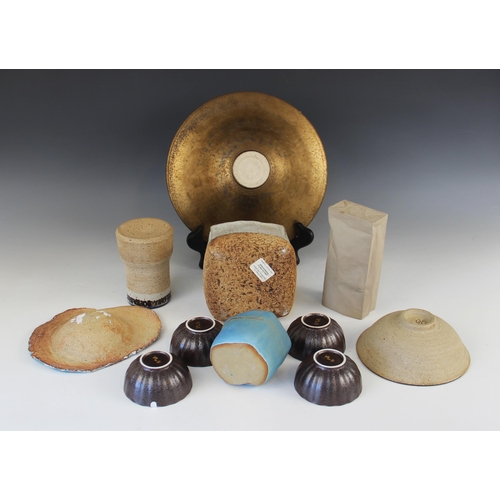 389 - A collection of mid-20th century and later studio pottery, to include a stoneware square section vas... 