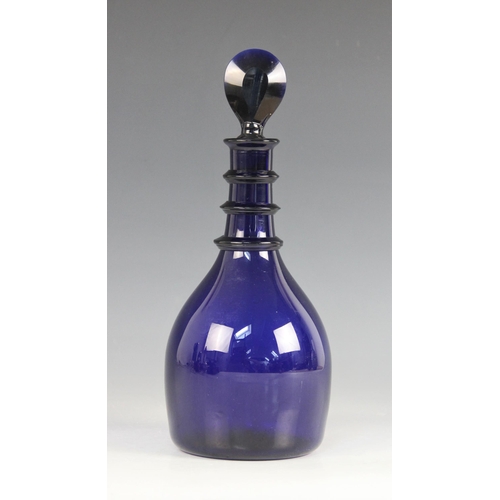 414 - A Georgian Bristol blue glass decanter, the mallet shaped body with triple ring neck, with bevelled ... 