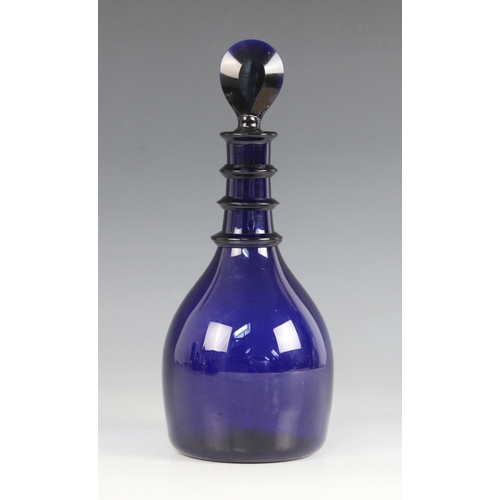 414 - A Georgian Bristol blue glass decanter, the mallet shaped body with triple ring neck, with bevelled ... 