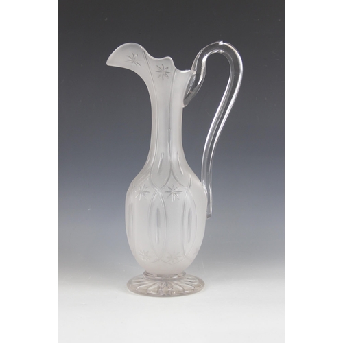 415 - A Victorian cut glass ewer, the frosted glass body of classical form with elongated neck and shaped ... 