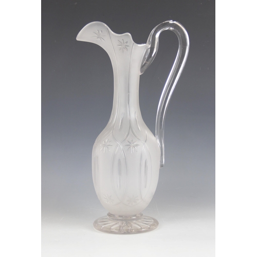 415 - A Victorian cut glass ewer, the frosted glass body of classical form with elongated neck and shaped ... 