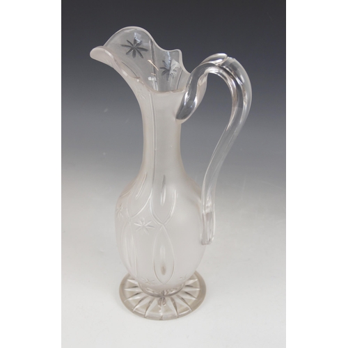 415 - A Victorian cut glass ewer, the frosted glass body of classical form with elongated neck and shaped ... 