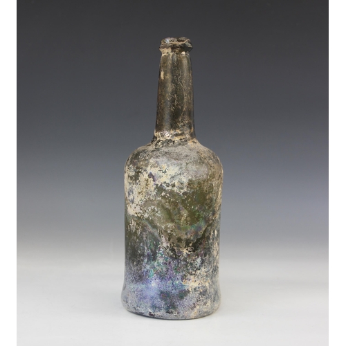 419 - An 18th century green glass wine bottle, of mallet form with 'kick-in' base, tapering neck and appli... 