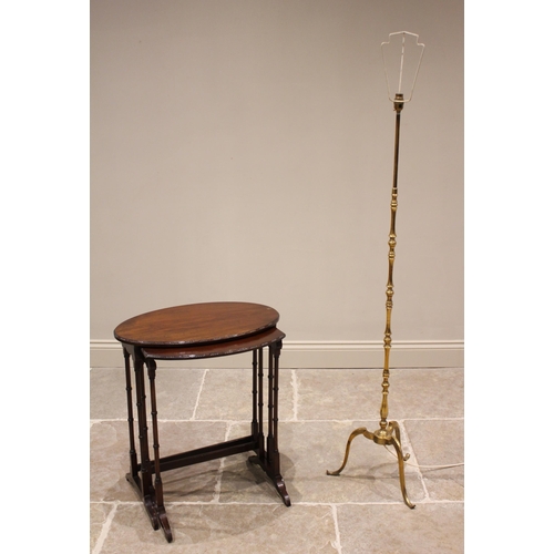 426 - A brass standard lamp, mid 20th century, of knopped form extending to three down swept supports, 136... 