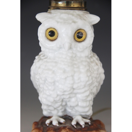 427 - A Staffordshire porcelain oil lamp modelled as a white owl, 19th century, the body forming the reser... 