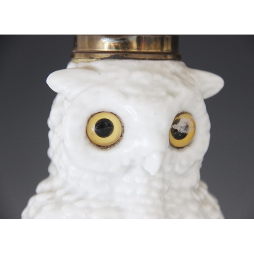 427 - A Staffordshire porcelain oil lamp modelled as a white owl, 19th century, the body forming the reser... 