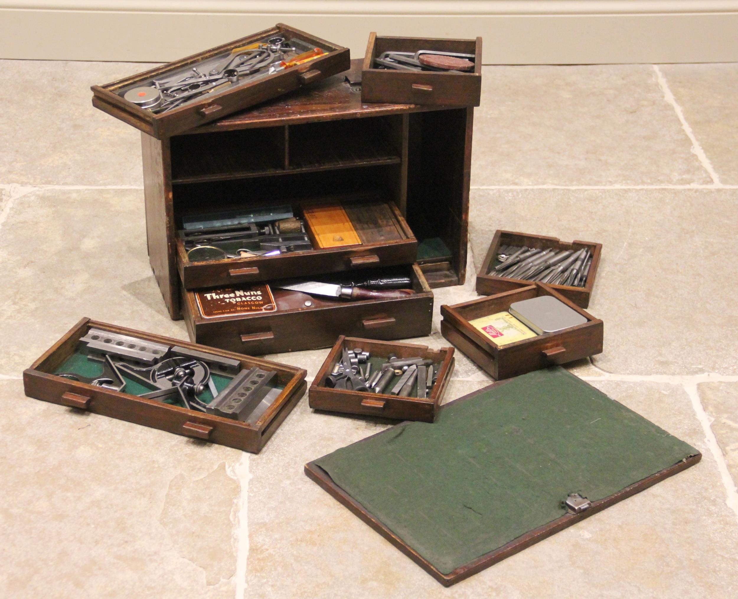 A late 19th/early 20th century stained pine joiners tool chest, the ...