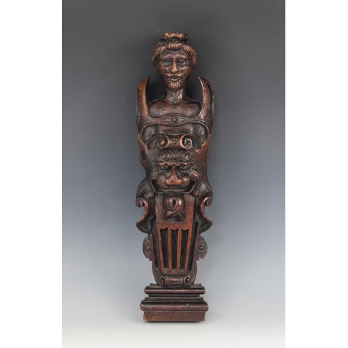 538 - A 17th century style oak figural term, carved as a bearded gentleman with a lion mask shield, 48cm h... 