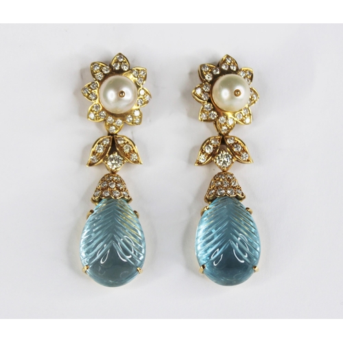 63 - A pair of blue topaz, pearl and diamond set 18ct gold drop earrings, each designed as a round cultur... 