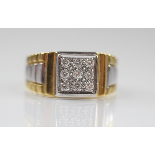 65 - An 18ct diamond set ring, the square shaped cluster set with nine brilliant cut diamonds, 9.2mm x 9.... 