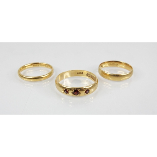 67 - A garnet set 22ct gold ring, marks for 'H.A', Birmingham 1914, size P 1/2, together with a 22ct gold... 