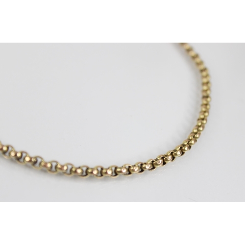 69 - An gold coloured chain, the faceted belcher link chain with spring ring and loop fastening, spring r... 