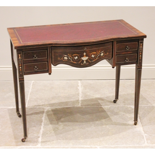 731 - An Edwardian Sheraton Revival rosewood ladies break front writing desk, the shaped central frieze dr... 