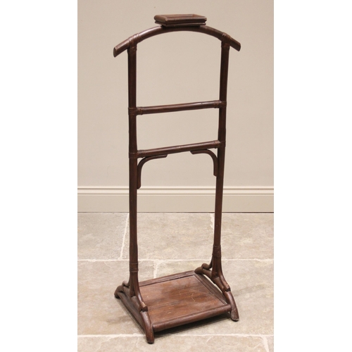 747 - An early 20th century stained bamboo gentleman's valet stand, of typical ladder form, with down swep... 