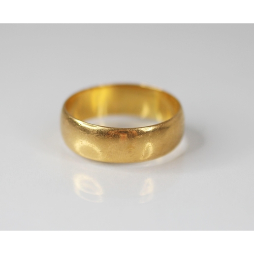 75 - A 22ct gold wedding band, marks for 'HWLd', Birmingham 1918, ring size T 1/2, weight 7.4gms