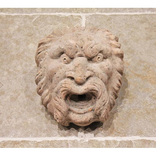 757 - A terracotta fountain head water feature, carved as a gargoyle mask, 36cm x 30cm