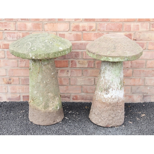 761 - A near pair of sandstone staddle stones, of typical mushroom form, 67cm high (approx)