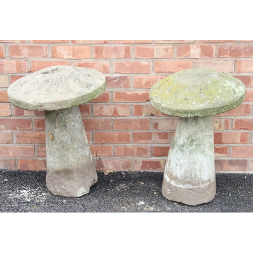 762 - A near pair of sandstone staddle stones, of typical mushroom form, 67cm high (approx)