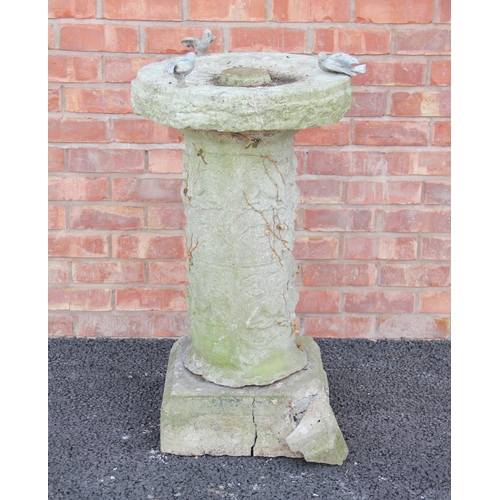 763 - A reconstituted stone bird bath, the circular bath on a cylindrical pillar and square plinth base, 9... 