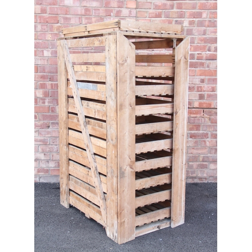 767 - An apple storage rack, with ten removable slatted drawers, 154cm high (at fault)