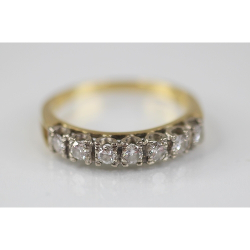 79 - A diamond half eternity ring by Boodle & Dunthorne, comprising seven round brilliant cut diamonds, t... 