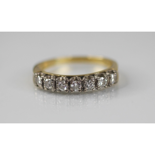 79 - A diamond half eternity ring by Boodle & Dunthorne, comprising seven round brilliant cut diamonds, t... 