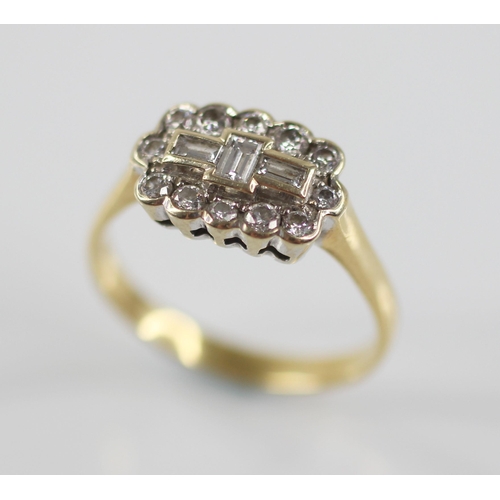 81 - A diamond 18ct gold cluster ring, the central boat shaped cluster designed as three baguette cut dia... 