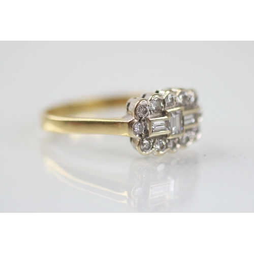 81 - A diamond 18ct gold cluster ring, the central boat shaped cluster designed as three baguette cut dia... 