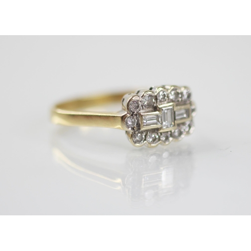 81 - A diamond 18ct gold cluster ring, the central boat shaped cluster designed as three baguette cut dia... 