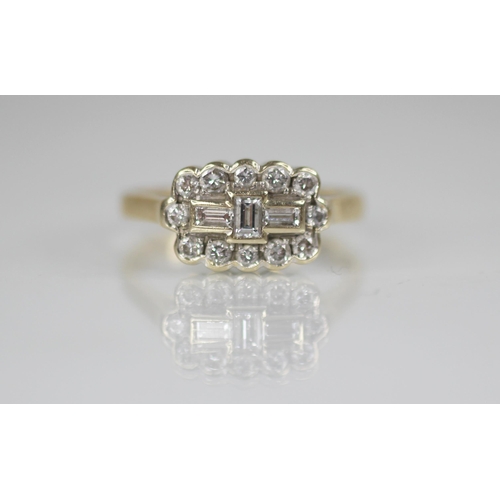 81 - A diamond 18ct gold cluster ring, the central boat shaped cluster designed as three baguette cut dia... 