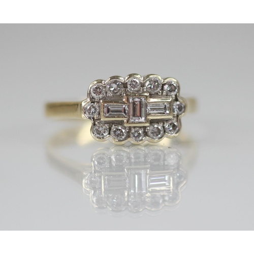 81 - A diamond 18ct gold cluster ring, the central boat shaped cluster designed as three baguette cut dia... 