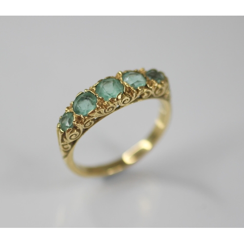 82 - A Victorian style five stone ring, comprising five graduated round mixed cut blue-green gemstones (p... 