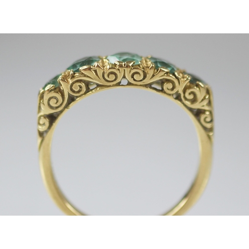 82 - A Victorian style five stone ring, comprising five graduated round mixed cut blue-green gemstones (p... 