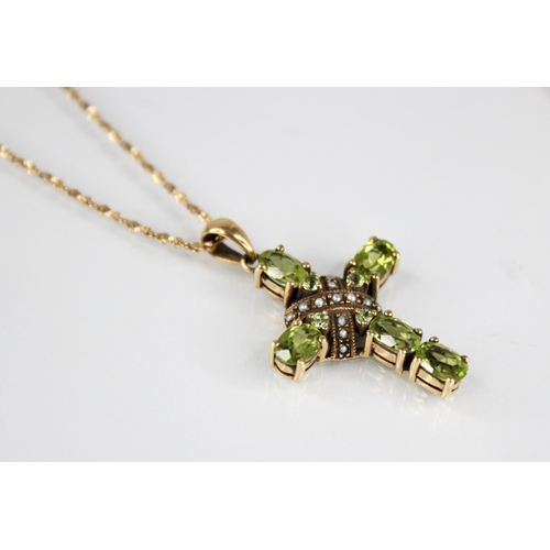 83 - A peridot and seed pearl 9ct Celtic cross pendant, comprising five oval mixed cut peridots to a seed... 