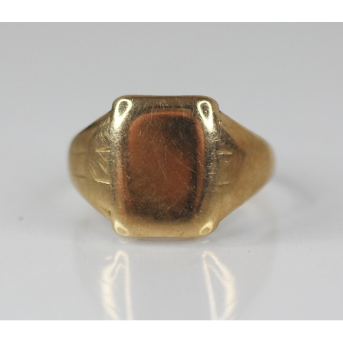 84 - A gentleman's gold coloured signet ring, the plain polished rectangular cartouche measuring 14mm x 1... 