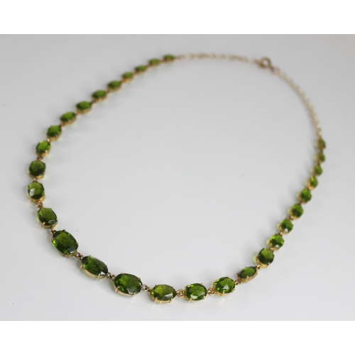 88 - A 19th century and later paste riviere necklace, designed as a single row of graduated oval green pa... 