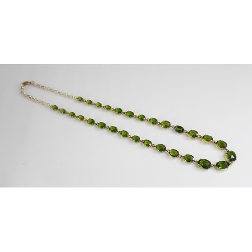 88 - A 19th century and later paste riviere necklace, designed as a single row of graduated oval green pa... 