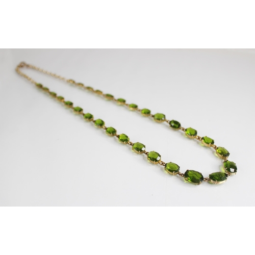 88 - A 19th century and later paste riviere necklace, designed as a single row of graduated oval green pa... 