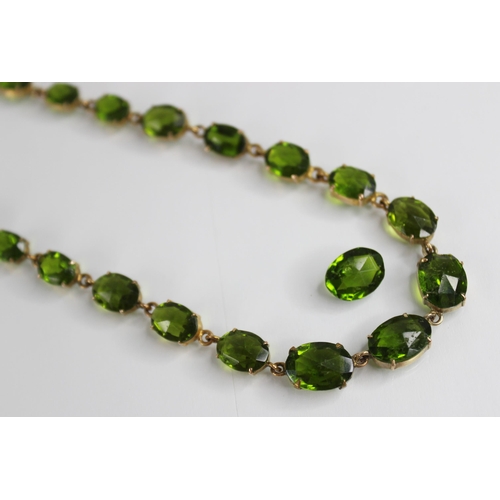 88 - A 19th century and later paste riviere necklace, designed as a single row of graduated oval green pa... 