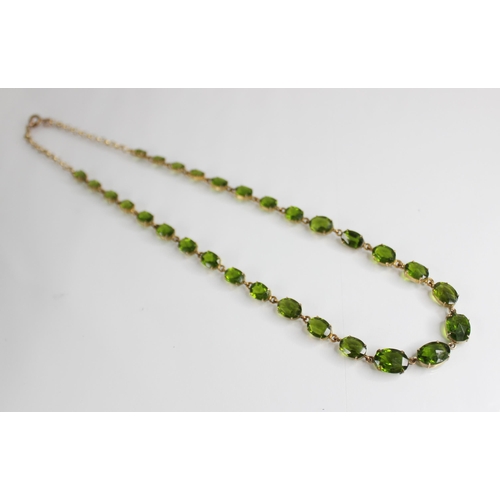 88 - A 19th century and later paste riviere necklace, designed as a single row of graduated oval green pa... 