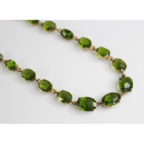 88 - A 19th century and later paste riviere necklace, designed as a single row of graduated oval green pa... 